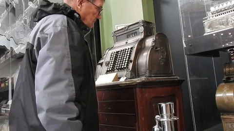 Man looking at an old cash register Video stock 71123936
