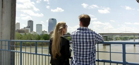 Man Looking Out Over Bridge Railing Видео 95997732