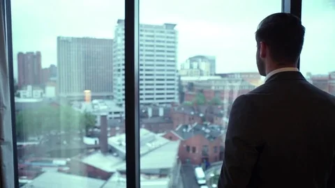 Man looking out over city Stock Footage 72903932