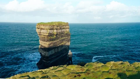 Man Looking Out Over the Cliffs at Downpatrick Head, Ireland Stock Footage 123443270