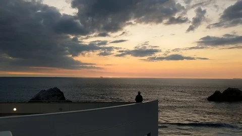 Man Looking Out Over the Ocean in San Francisco at Sunset Stock Footage 126890840