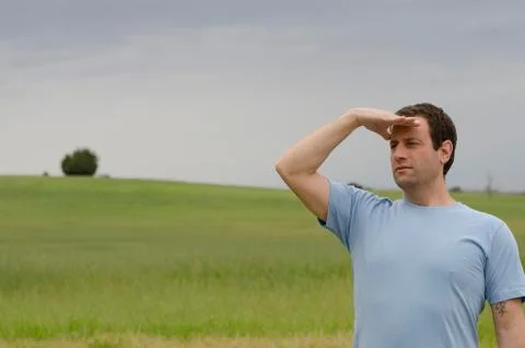 Man looking out to what the future holds. Stock Photos