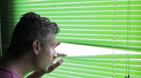 Man looking out window Stock Footage 50864441