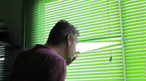 Man looking out window Video stock 50865726
