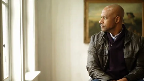 Man looking out of the window. 스톡 동영상 88406162