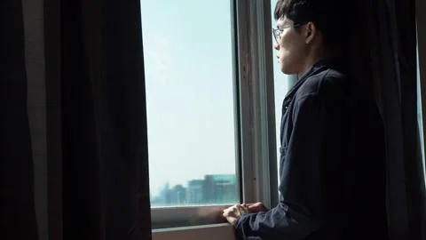 Man looking out the window Stock Footage 127237341