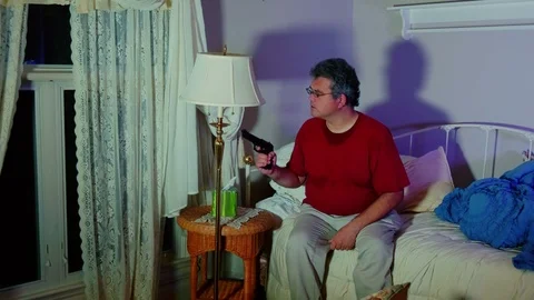 Man looking outside scared with a gun Stock-Footage 95154881