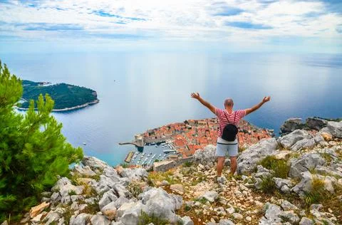 Man looking at panoramic view of  famous old city Dubrovnik, Croatia Stock Photos