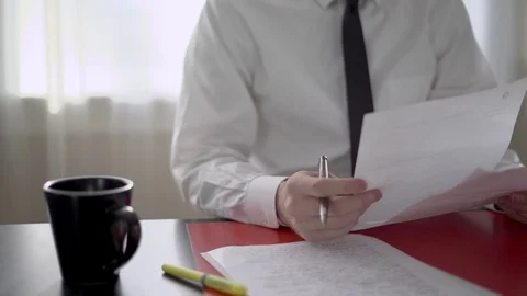 Man looking at paperwork Stock Footage 71627779