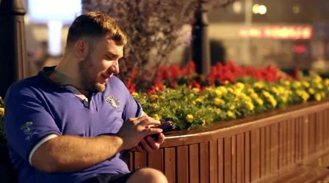 Man looking at phone Stock Footage 65405267