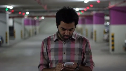 Man looking at phone Stock Footage 111774441