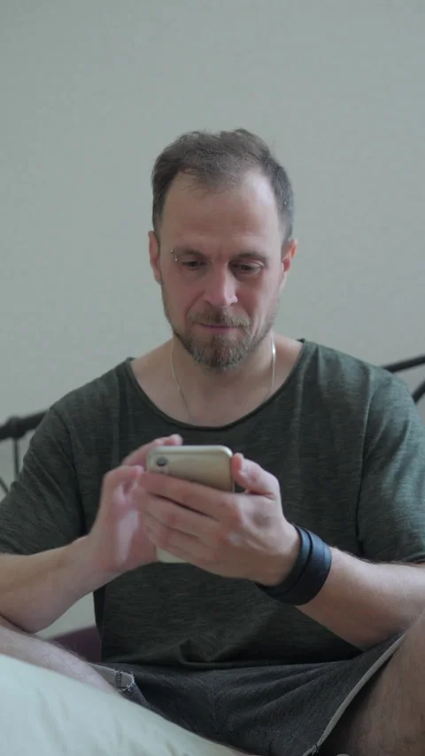 Man looking at phone.vertical video Stock Footage 313359616
