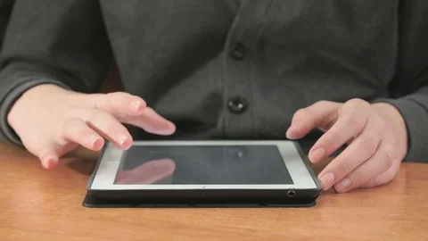 Man looking at photos using computer tablet Stock-Footage 84240256