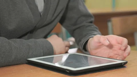 Man looking at photos using computer tablet Stock Footage 87574831