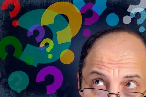 Man looking to question marks Stock Photos