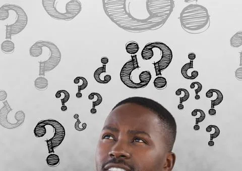 Man looking up at question marks Stock Photos