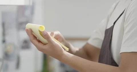 Man looking at recipes on notes Stock Footage 100944379