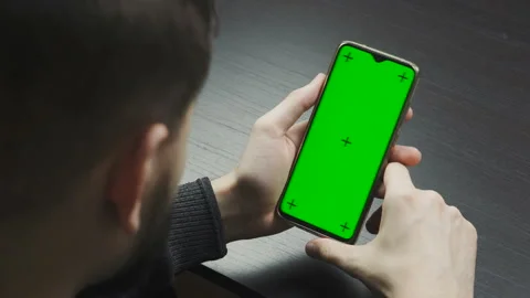 Man looking at screen of mobile phone Stock Footage 145015831