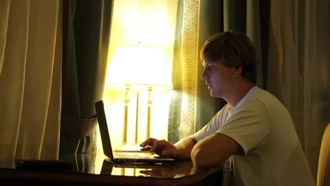 Man is Looking at Screen, Working With Laptop, Videocall, Talking on Skype Stock-Footage 97084290