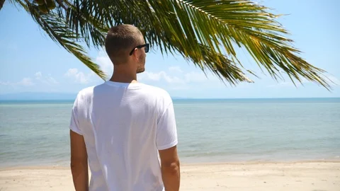 Man Looking At The Sea On Summer Beach Vacation Video stock 99092375