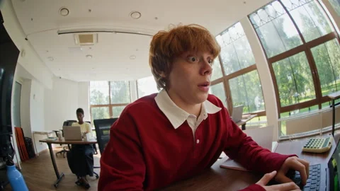 Man Looking Shocked with Surprised Expression at Laptop in Office Stock Footage 343710150