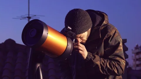 Man Looking At Sky With Telescope Stock Footage 111340949