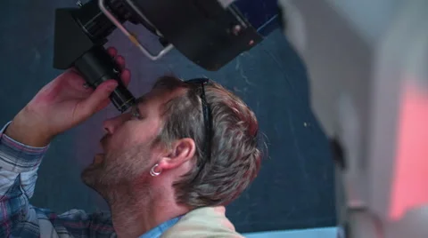 Man looking at the sky trough telescope Stock Footage 46879167