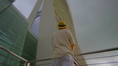 Man Looking Up At Skyscraper Stock Footage 116497386