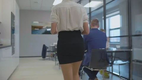 Man looking at slender legs of passing woman Stock Footage 107906422