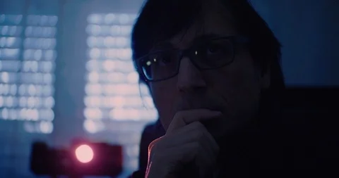 Man looking slide show using a photo slide projector Stock Footage 100989504