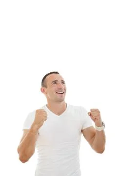 Man looking up with a slightly raised arms and clenched fists Stock Photos