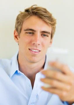 Man looking at smart phone, texting Stock Photos