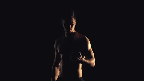 Man looking in smartphone on black background Stock Footage 99701584