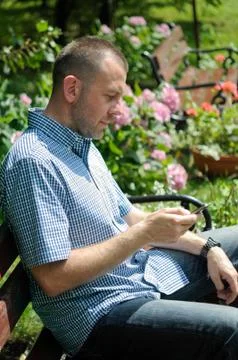 Man looking at smartphone Stock Photos