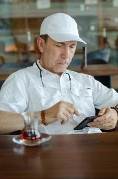Man is looking on smartphone Stock Photos