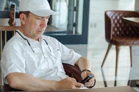 Man is looking on smartphone Stock Photos