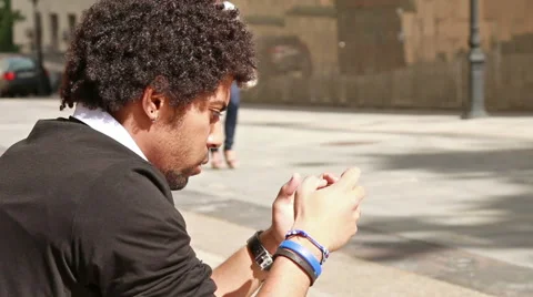 Man looking at smartphone while girl passing by Video stock 54176394
