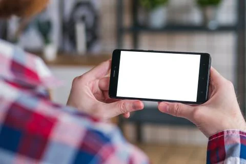 Man looking at smartphone with white empty display Stock Photos