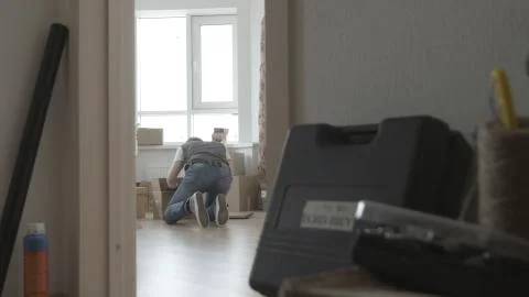 Man is looking for something in a box, general view Photos