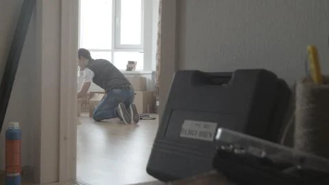 Man is looking for something in a box, general view Photos