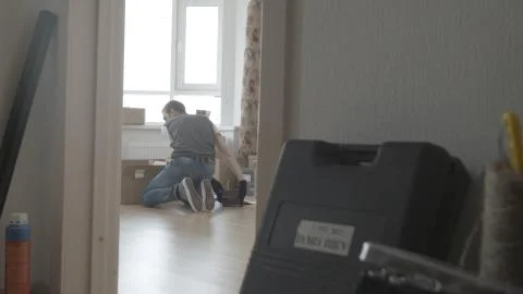 Man is looking for something in a box, general view Photos