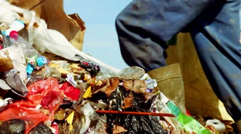 Man looking for something in Garbage Video stock 50637561