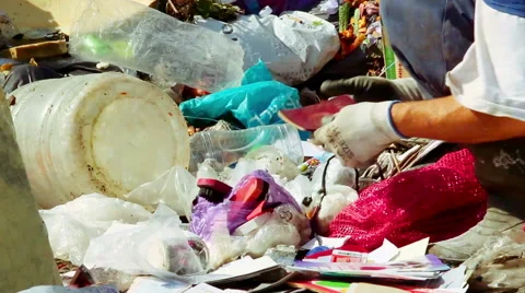 Man looking for something in Garbage Stock Footage 50637643