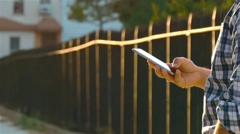 A man is looking for something in the internet using a smartphone. Stock Footage 62528942