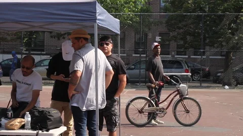 Man Looking At A Speaker From A Bike 動画素材 106535448