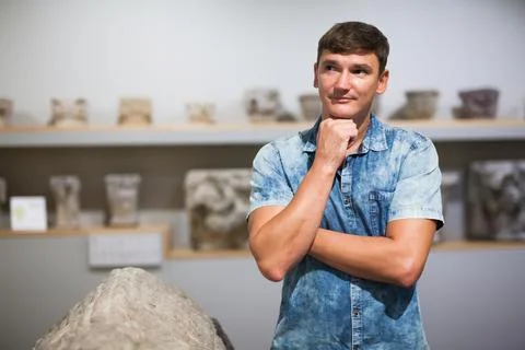 Man looking at stone architectural elements Stock Photos
