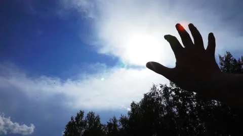 Man Looking To The Sun Through Fingers Stock Footage 44452973