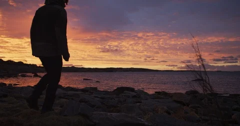 Man looking at the sunrise. Stock Footage 106118982