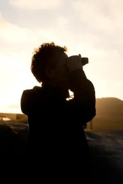 Man looking at sunset Foto stock