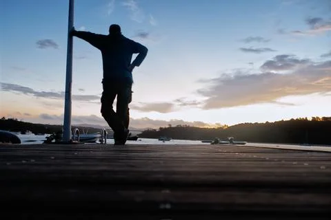 A man looking at the sunset Stock Photos